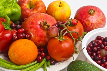 Fruits and Vegetables on plates and a bowl.